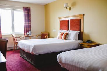 فندق Inn On The Coast