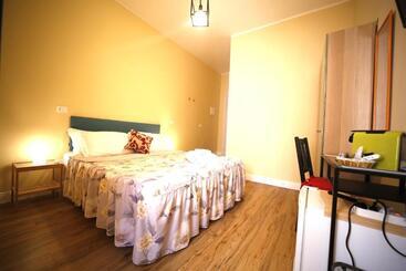 تختخواب و صبحانه Al Quadrato D Oro Rooms