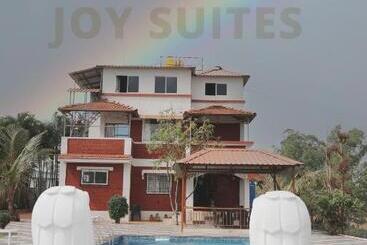 호텔 Green Mountain Cottages By Joy Suites