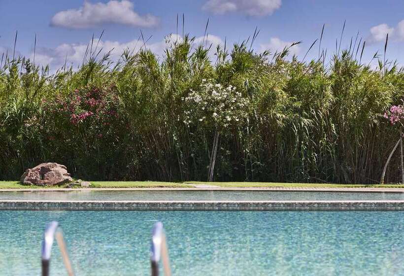 Отель Baia Di Chia Resort Sardinia, Curio Collection By Hilton