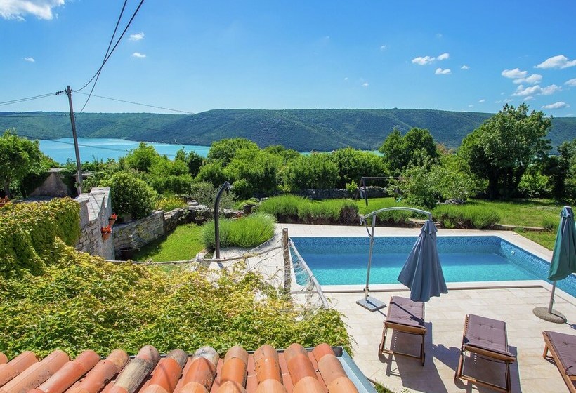 Surrounded By Beautiful Mediterranean Vegetation And The Crystal Clear Sea