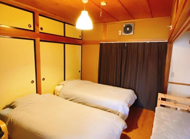 Пансион Mooi Guesthouse 日新町