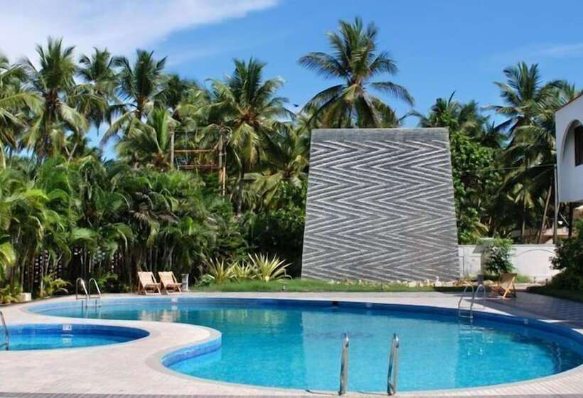 فندق Paradise Isle Beach Resort