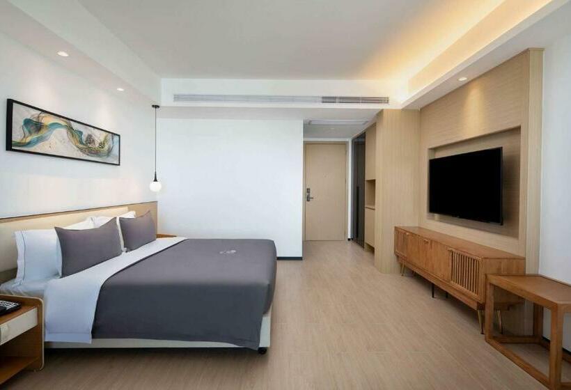Отель Ramada Encore By Wyndham Jiusuo Downtown