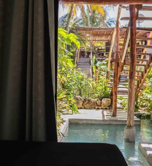 اتاق استاندارد سه تخته با چشم‌انداز باغ, Casa Mate Beachfront Cabañas El Cuyo