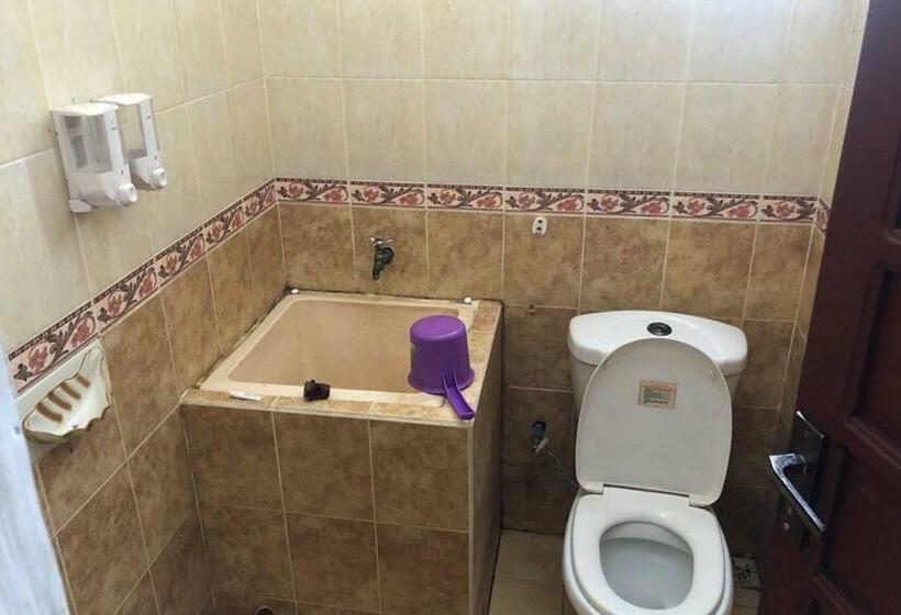Номер Deluxe, Wisma Gardenia Palangkaraya Syariah Redpartner