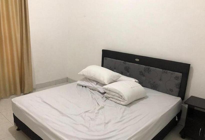 Номер Deluxe, Wisma Gardenia Palangkaraya Syariah Redpartner