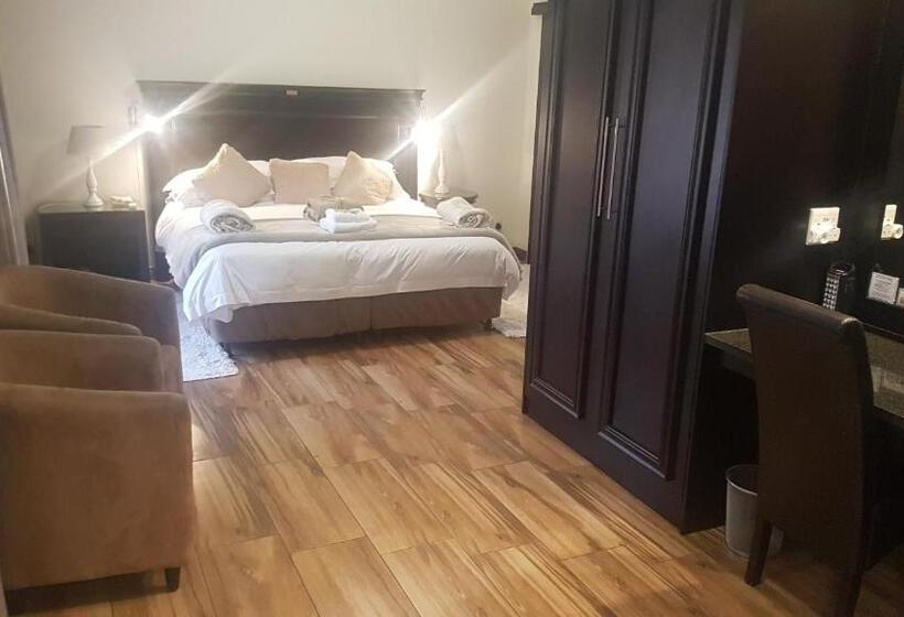 Quarto Deluxe, Cornerstone Guest Lodge