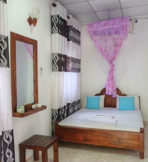 اتاق خانوادگی با چشم‌انداز باغ, Golden Rainbow Guest House