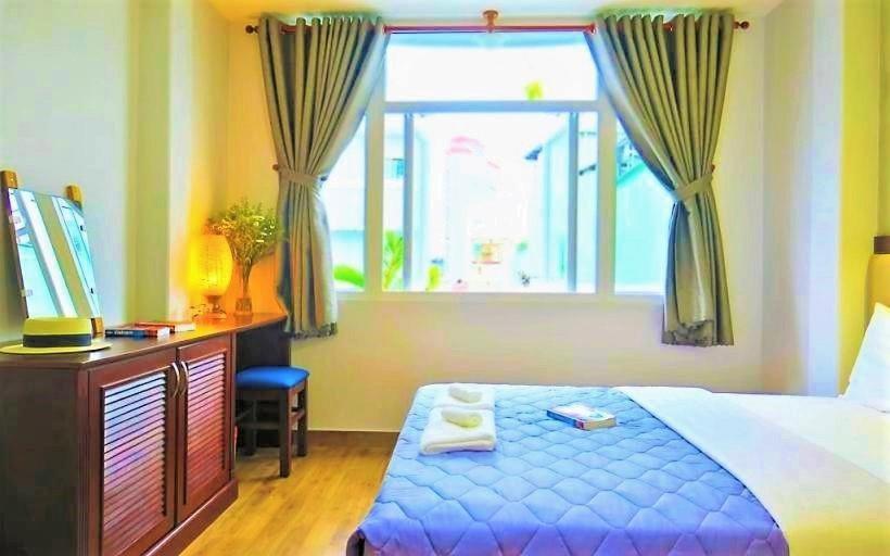 اتاق لوکس سه تخته, Giang Sơn Hotel江山民宿范五老区酒吧街胡志明市
