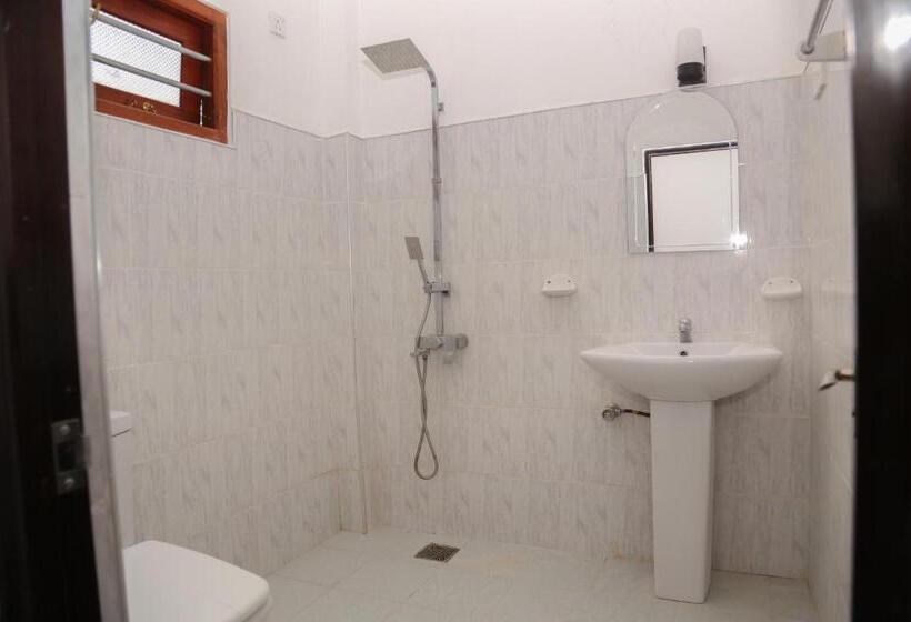 اتاق استاندارد با چشم‌انداز باغ, Tithira Guest House