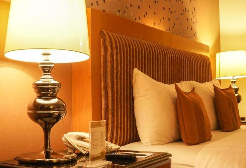キングサイズベッドのデラックスルーム, Grand Rocky Hotel Bukittinggi
