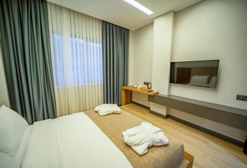 Quarto standart vista jardim, Aksular