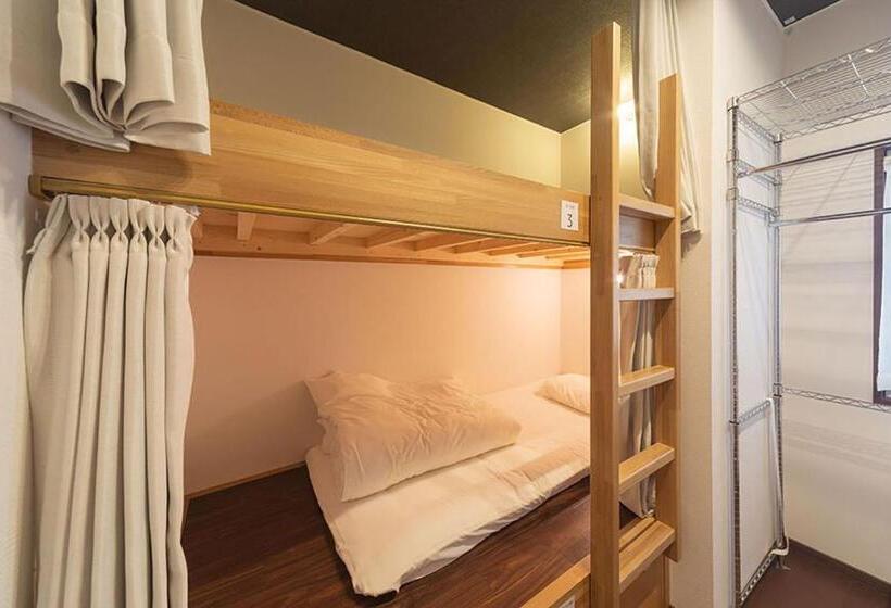 Кровать в Общей Комнате, Guesthouse Nibutani Yanto
