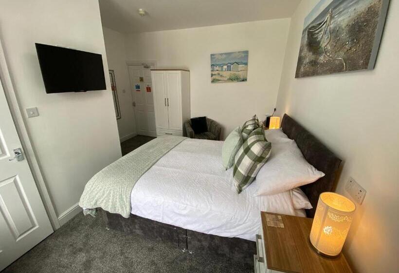 חדר דחוקס עם מיטת קינג, Coach Guest House
