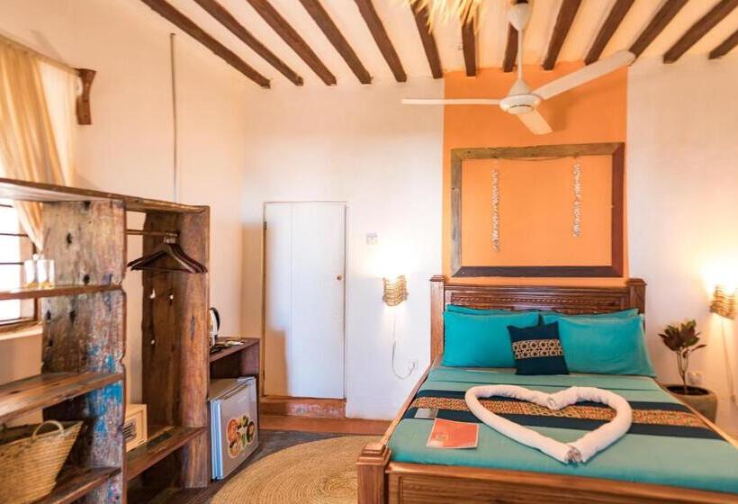 اتاق استاندارد سه تخته با چشم‌انداز باغ, Pili Pili Beach Bungalows